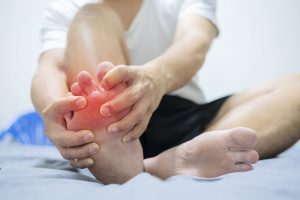 Man experiencing pain in ball of foot