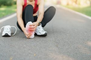 Can Ottawa Pedorthists Help Athletes With Injuries? Young adult female with his muscle pain during running. runner woman having leg ache due to Plantar fasciitis. Sports injuries and medical concept