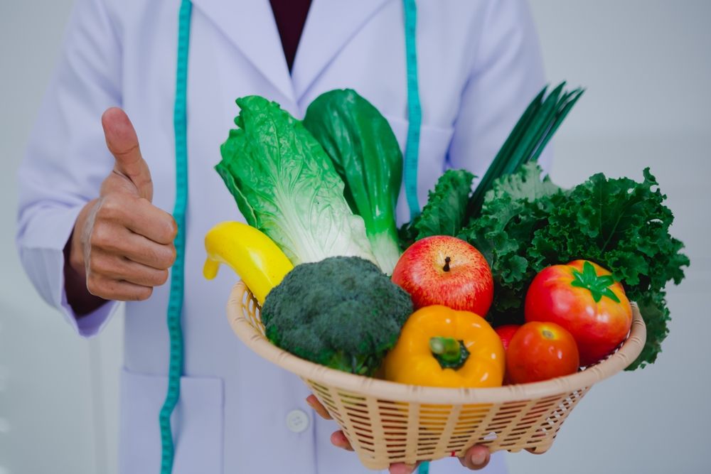 Fueling Your Ottawa Winter: Nutrition Tips for Staying Energized and Healthy? Asian male nutritionist specializing in promoting healthy eating habits, providing nutritional advice, creating meal plans, and helping individuals achieve optimal health through balanced nutrition.